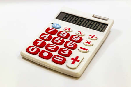 Red Button calculator on white backgroundの写真素材