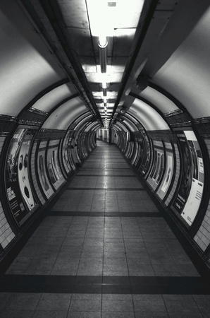 Empty and eerie underground station tunnel in the city of London Embankmentの素材