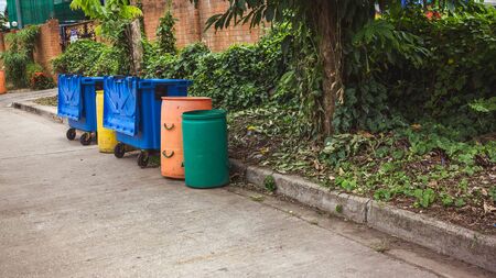 Small and large plastic bins recycle on the streetの写真素材