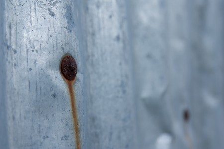 Rust of old steel plate on corrugated ironの写真素材