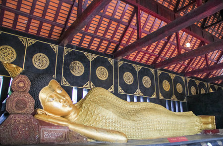 sleeping golden buddha image in Chiang mai temple of Thailandの写真素材