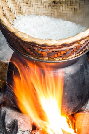 Thai local sticky rice original cooking in small villageの写真素材