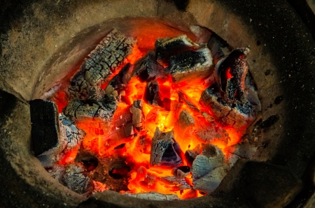 burning charcoal in stove ready for cookingの写真素材