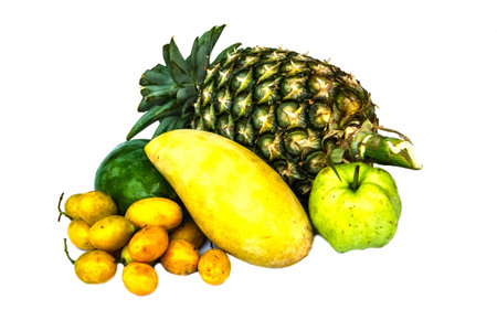 Green and yellow tropical fruit on white background