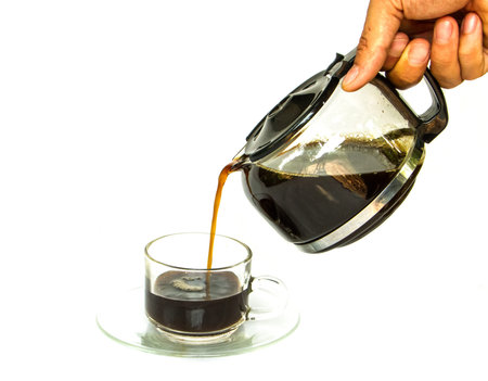 coffee pouring to the cup on white background