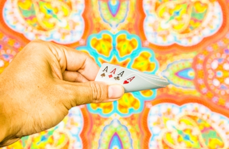Hand holding cards on indian graphic backgroundの写真素材