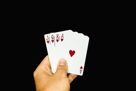 Cards holding by hand on black  backgroundの写真素材