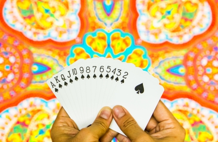 Hand holding cards on indian graphic backgroundの写真素材