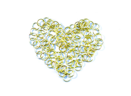 Golden chain in the heart sign on white background 