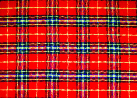 Red scott fabric close up background.