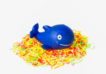 Blue rubber whale on colorful elasticの写真素材