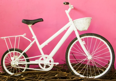 Vintage white bicycle on the pink wall.の写真素材