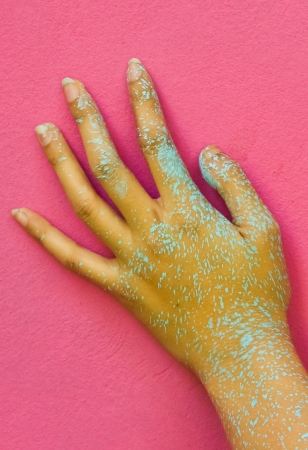 Painted hand on the pink wall.の写真素材