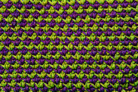 Green and purple crocheting close up .の写真素材