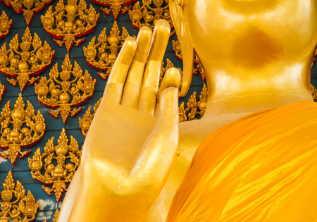Golden buddhist image close up for hand sign .の写真素材