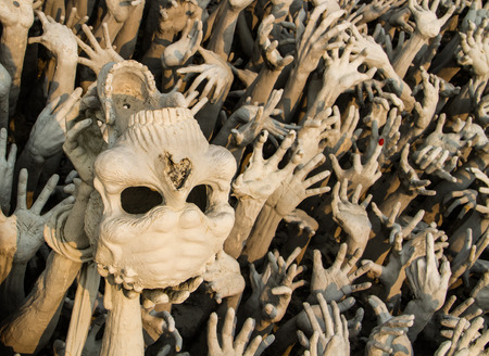 Human hands and skull figure show about buddhist story.の写真素材