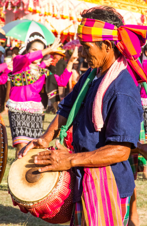 MAHASARAKHAM,THAILAND - MAY 18 : Thai traditional musician performing Thai music  in Rocket festival "Boon Bang Fai" parade  on May 18,2014 .This festival for agriculture  to celebration the raining season.のeditorial素材