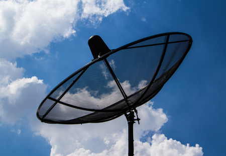 SAtellite TV receiver on blue sky with cloud  background.の写真素材
