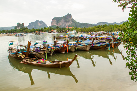 KRABI,THAILAND-JUNE 21 : Longtail boat available for service tourist on the beach of Krabi on 21 June 2014.Krabi beach is one of the most popular beach in Thailand.のeditorial素材