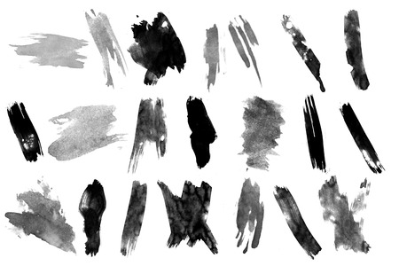 Black ink brush strokes on white background.の写真素材