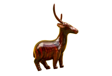 Wooden deer carved on white background.の写真素材