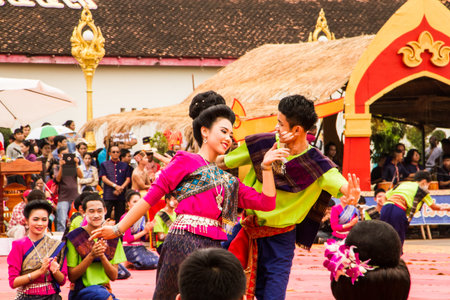 NAKHON PHANOM ,THAILAND-OCTOBER 8: A group of Thai dancers perform Thai dancing in front of Pratat...