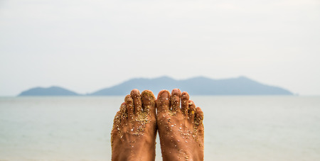 Human feet with sea view.の写真素材