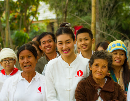 Chiang rai,Thailand-January 1,2015 : Khemanit Jamikorn  join with buddhism to offer food for monk   in Rai Cherntawan meditation center.She is famous actress in Thailand .のeditorial素材