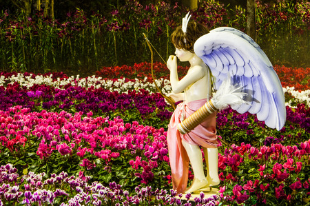 Chiang rai,Thailand-January 4,2015 : Cupid model holding the arrows in Chiang rai National Floral Festival 2014 .This event will come in winter time every year.のeditorial素材