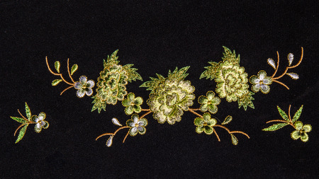 Beautiful flower embroider on black background.の写真素材