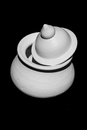 White clay pot on black background.の写真素材