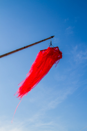Red lantern on blue sky background.の写真素材