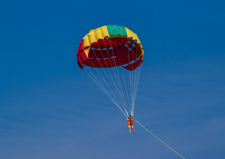 PHUKET,THAILAND-FEBRUARY 27 : Tourist enjoy parasailing at  Patong beach in Phuket,Thailand on February 27,2015.Patong beach is popular for water sport.のeditorial素材