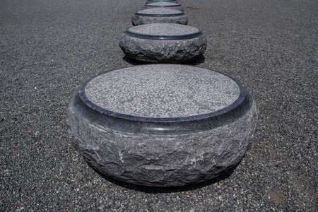 Circle stone benches on stone floor.の写真素材