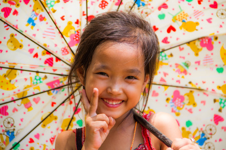 The girl with colorful umbrella .の写真素材