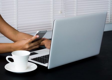 Computer notebook on working table.の写真素材