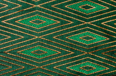 Thai style pattern fabric close up background.の写真素材