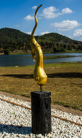 Buddhist art decoration "Golden naga head".の写真素材