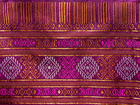 Thai style pattern fabric close up background.