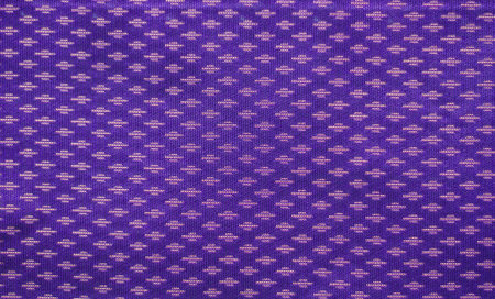Thai style pattern fabric close up background.