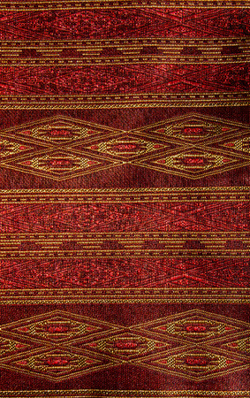 Thai style pattern fabric close up background.の写真素材