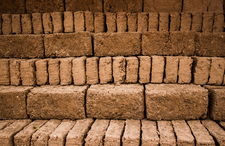 Earthern bricks close up background.の写真素材