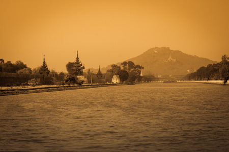 Mandalay palace wall with Mandalay hill background.の写真素材