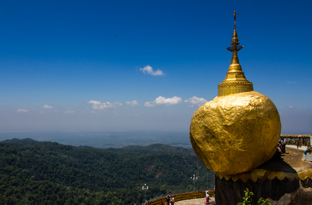 KYAIKTIYO,MYANMAR-MARCH 13,2017: Pilgrims are praying at the Kyaiktiyo Pagoda, Golden Rock. Kyaiktiyo Pagoda also known as Golden Rock is a well known Buddhist pilgrimage site in the Mon State, Myanmar.のeditorial素材