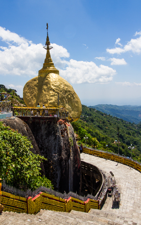 KYAIKTIYO,MYANMAR-MARCH 13,2017: Pilgrims are praying at the Kyaiktiyo Pagoda, Golden Rock. Kyaiktiyo Pagoda also known as Golden Rock is a well known Buddhist pilgrimage site in the Mon State, Myanmar.のeditorial素材