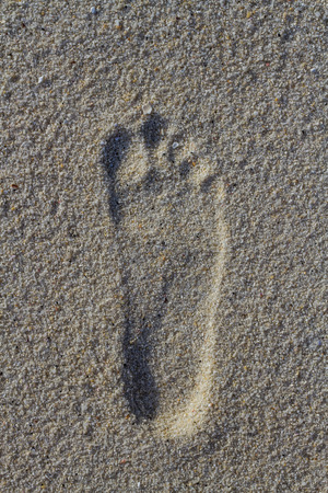 Foot imprint on the sand.の写真素材