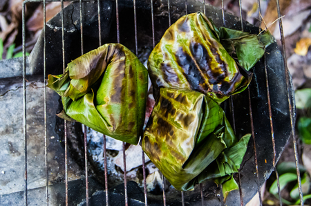 Thai food wrap by banana leaf grilled.の写真素材