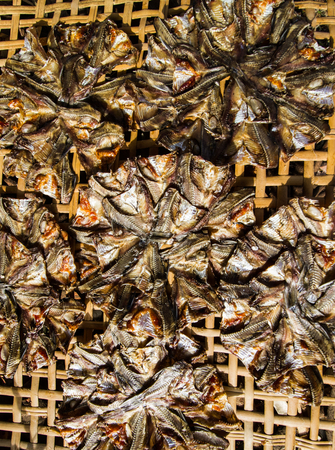 Dried fish on bamboo basket.の写真素材