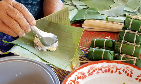Thai sweet cooking wraped by banana leaf.の写真素材