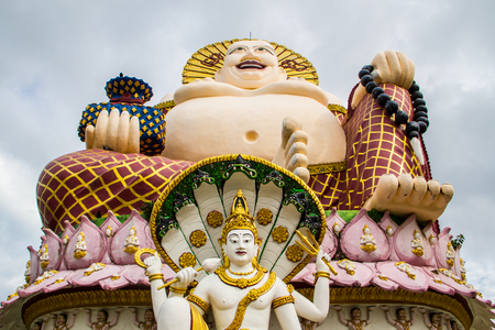 Statue of a fat Chinese priest in Buddhist temple at Koh Samui,Thailand.の写真素材